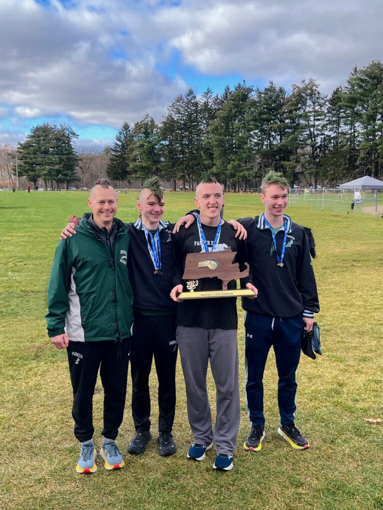 Coach Ben Benoit, Captains Henry Jacobsen, Caleb Hatlevig, Connor Stach